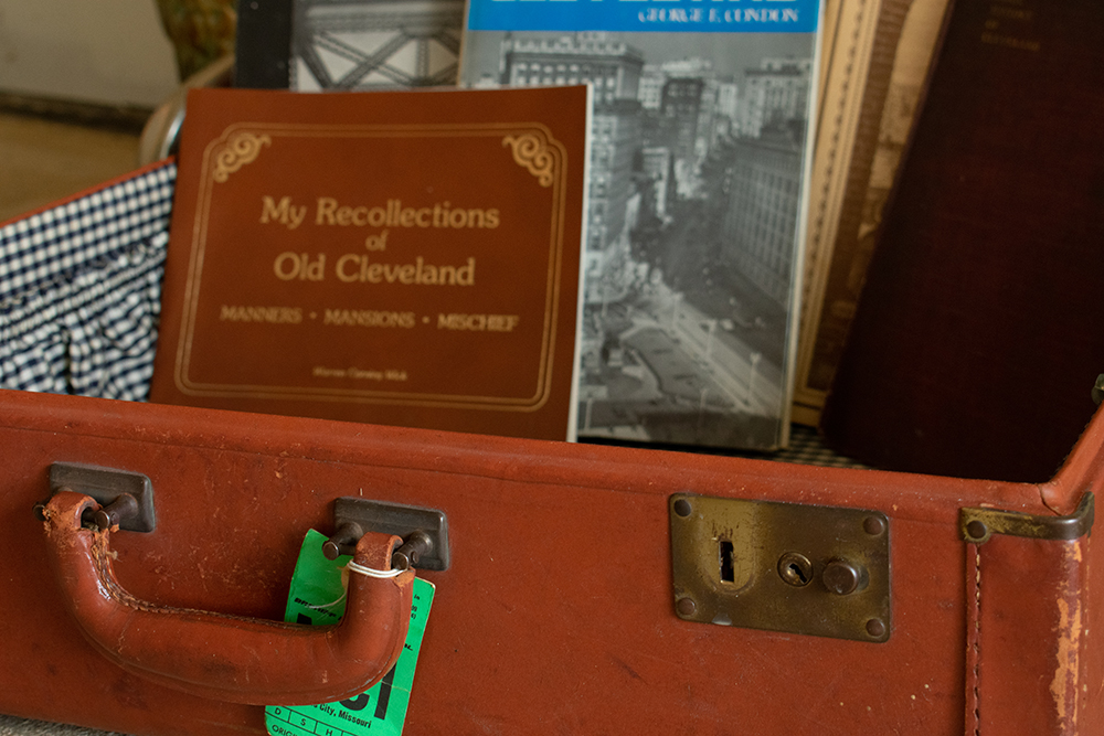 Antique suitcase with Cleveland history books inside. Product photography for Relic Vintage.