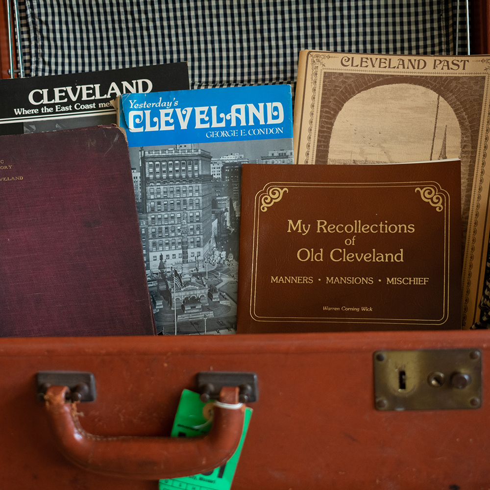 Cleveland history books and magazines in antique suitcase. Product photography for Relic Vintage.