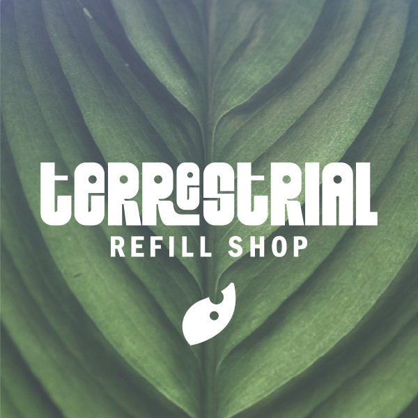 Terrestrial Refill Shop app on iPhone with faded leaf in the background.